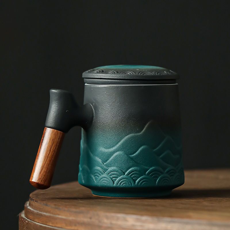 Handcrafted Ceramic Tea Mug with Infuser and Lid – 400ml Heat-Resistant Cup with Wooden Handle, Artistic Mountain Design Three-piece Set
Handcrafted Ceramic Tea Mug with Infuser and Lid – 400ml Heat-Resistant Cup with Wooden Handle, Artistic Mountain Design Three-piece Set