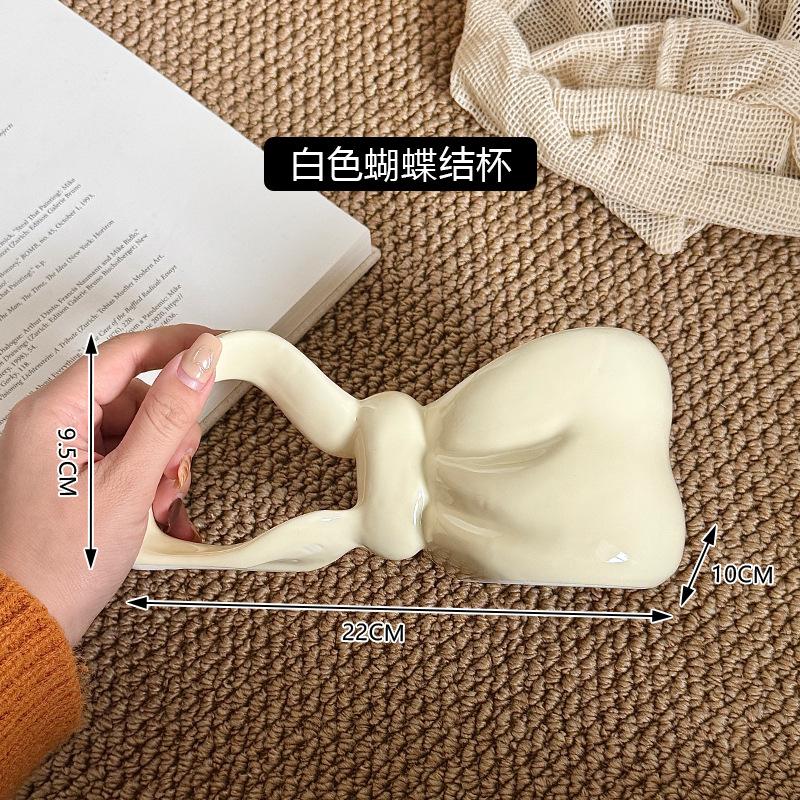 Ветер Форма банта Керамическая чашка Чувство дизайна Цветная глазурь Подарок для девочек Высокая ценность Парная чашка 350ML