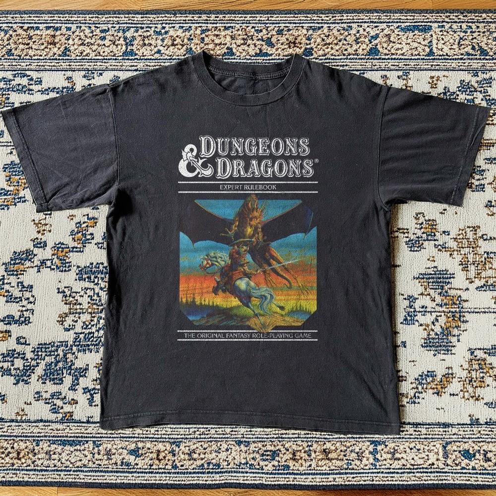 Dungeons amp Dragons Expert Rulebook Retro Unisex TShirt Black Size S5XL Unisex T-Shirt XXXL
Dungeons amp Dragons Expert Rulebook Retro Unisex TShirt Black Size S5XL Unisex T-Shirt XXXL