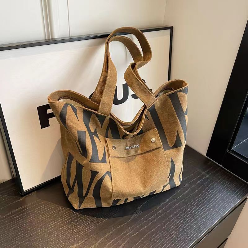 Women’s Canvas Tote Bag Large Capacity Letter Print Shoulder Bag Casual Handbag Fashion Crossbody Bag with Front Pocket for Daily Travel Shopping
Women’s Canvas Tote Bag Large Capacity Letter Print Shoulder Bag Casual Handbag Fashion Crossbody Bag with Front Pocket for Daily Travel Shopping