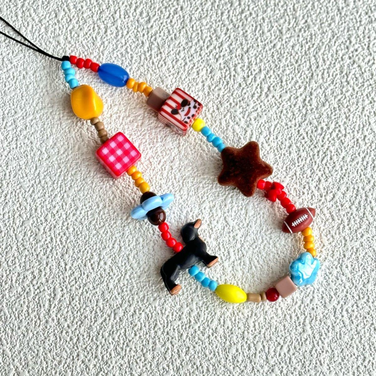 Original Cartoon Dachshund Phone Charm: Colorful Beaded Pendant with Cute Anti-Drop Rope
Original Cartoon Dachshund Phone Charm: Colorful Beaded Pendant with Cute Anti-Drop Rope