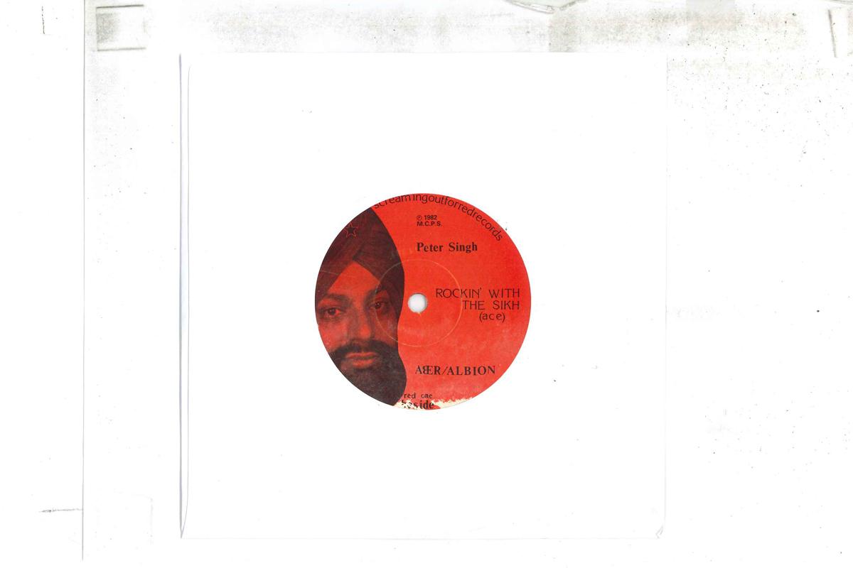 7inch Record PETER SINGH Rockin With The Sikh Elvis Im RED1 SCREAMINGOUTFO 1982 UK Rock Used
7inch Record PETER SINGH Rockin With The Sikh Elvis Im RED1 SCREAMINGOUTFO 1982 UK Rock Used