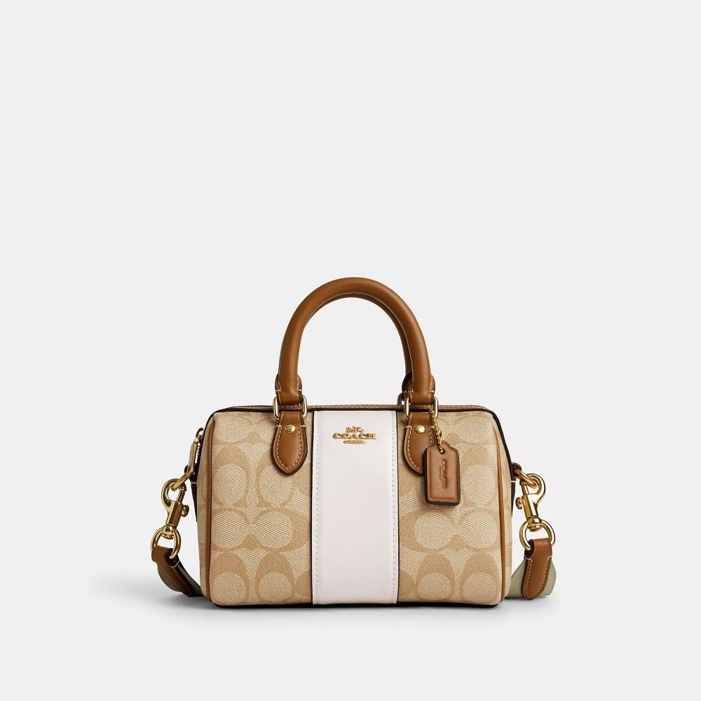 Сумка через плечо Coach Mini Rowan из канвы Signature с полосками светло-хаки, седло для мела
Сумка через плечо Coach Mini Rowan из канвы Signature с полосками светло-хаки, седло для мела