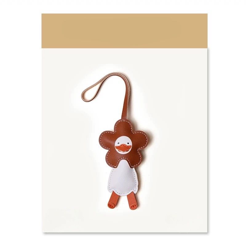 Шарм для сумки в виде цветка и утенка, милый мультяшный брелок-подвеска, подарок коричневый
Шарм для сумки в виде цветка и утенка, милый мультяшный брелок-подвеска, подарок коричневый