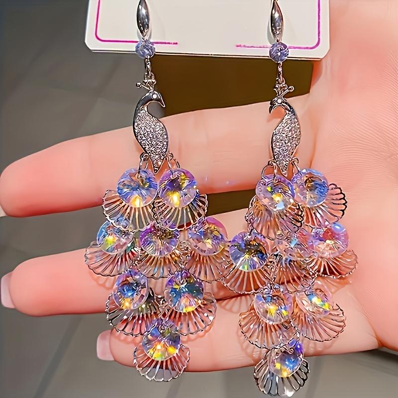 1 Pair of Women s Luxury Peacock Pendant Earrings, Crystal Decoration, Hollow Leaf Tassel Design, 925 Sterling Silvery Ear Hook, UV Coated Alloy, All фиолетовый
1 Pair of Women s Luxury Peacock Pendant Earrings, Crystal Decoration, Hollow Leaf Tassel Design, 925 Sterling Silvery Ear Hook, UV Coated Alloy, All фиолетовый