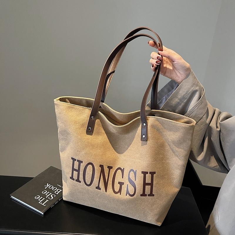 New washed canvas shoulder bag large capacity simple letter tote bag women s class work bag
New washed canvas shoulder bag large capacity simple letter tote bag women s class work bag