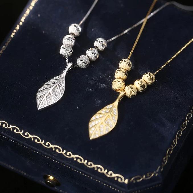 S925 Sterling Silver Tree Leaf Necklace with Gold-Carved Lucky Bead - Korean Style, Versatile, Light Luxury Feel for Women. 925 Silver
S925 Sterling Silver Tree Leaf Necklace with Gold-Carved Lucky Bead - Korean Style, Versatile, Light Luxury Feel for Women. 925 Silver