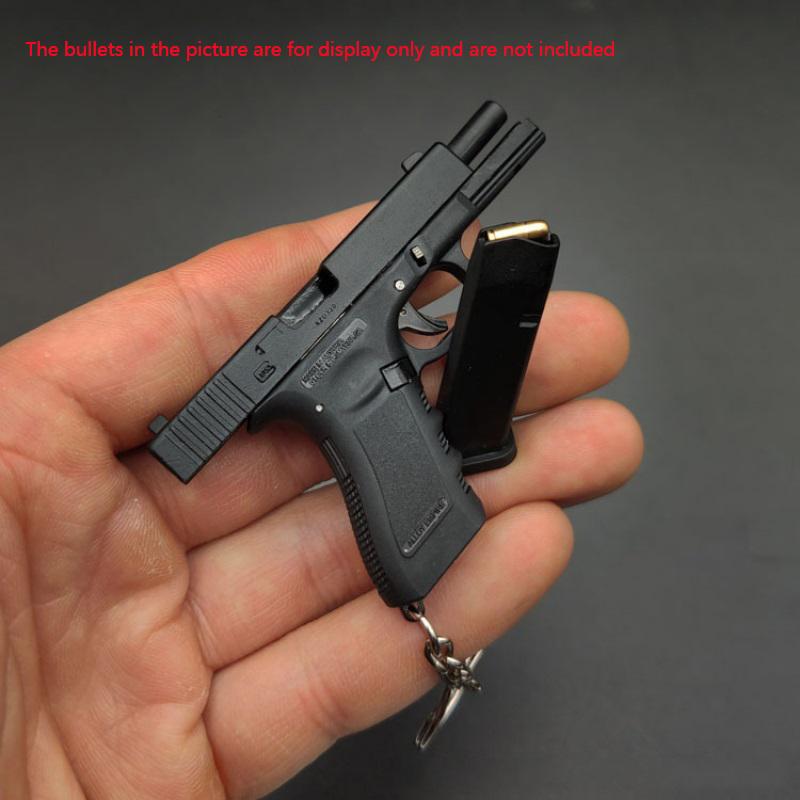 Сплав 1:3 Брелок Glock Модель пистолета Украшения Высокая симуляция съемного солдатского снаряжения
Сплав 1:3 Брелок Glock Модель пистолета Украшения Высокая симуляция съемного солдатского снаряжения
