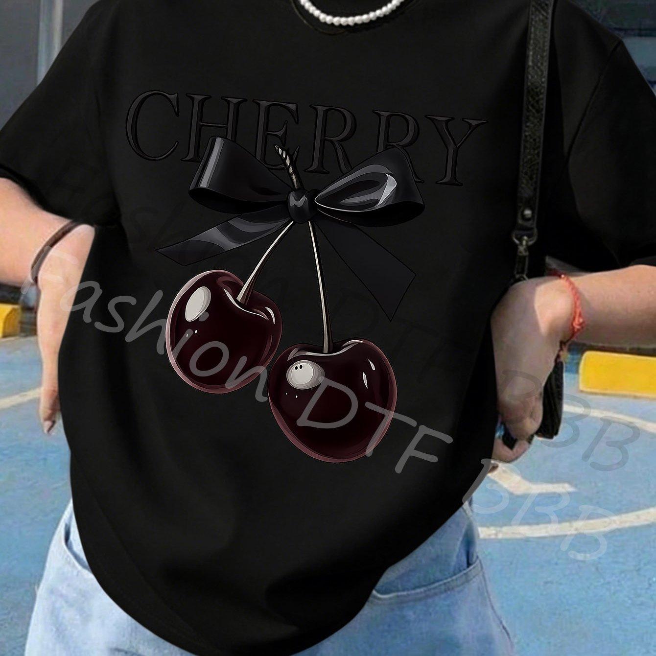 The T-shirt features a vibrant black bow and cherry print, perfect for a casual summer outing. XL
The T-shirt features a vibrant black bow and cherry print, perfect for a casual summer outing. XL