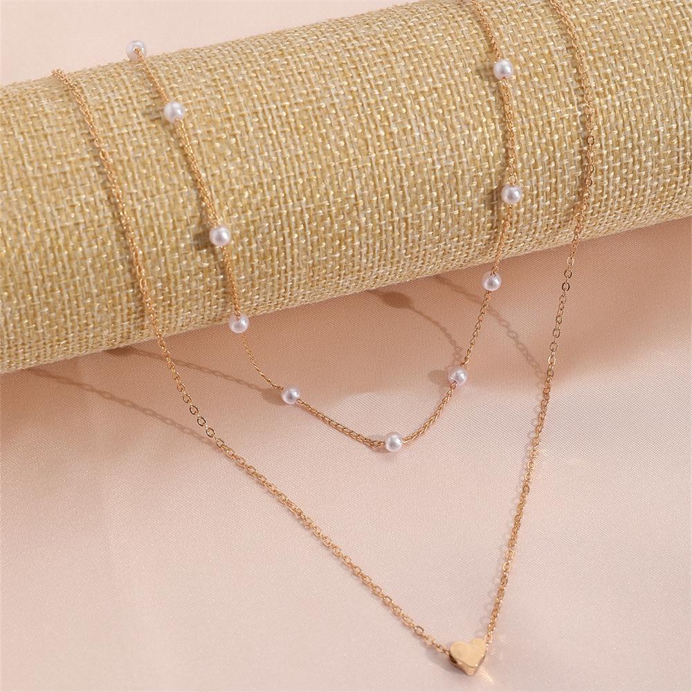 Ожерелье-подвеска Любовь из искусственного жемчуга, универсальная цепочка для ключиц, женское винтажное многослойное ожерелье
Ожерелье-подвеска Любовь из искусственного жемчуга, универсальная цепочка для ключиц, женское винтажное многослойное ожерелье