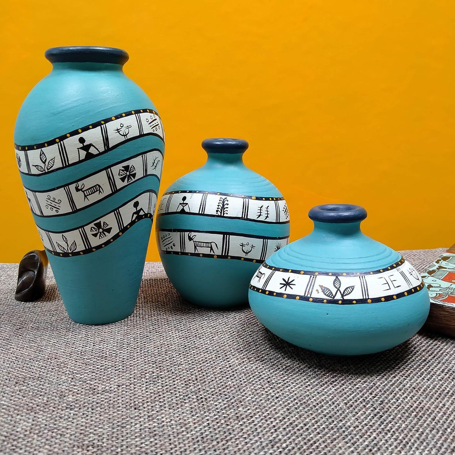 Earthenware Warli Turquoise Blue Handpainted Terracotta Oblong Flower Vase, Terracotta Decorative
Earthenware Warli Turquoise Blue Handpainted Terracotta Oblong Flower Vase, Terracotta Decorative