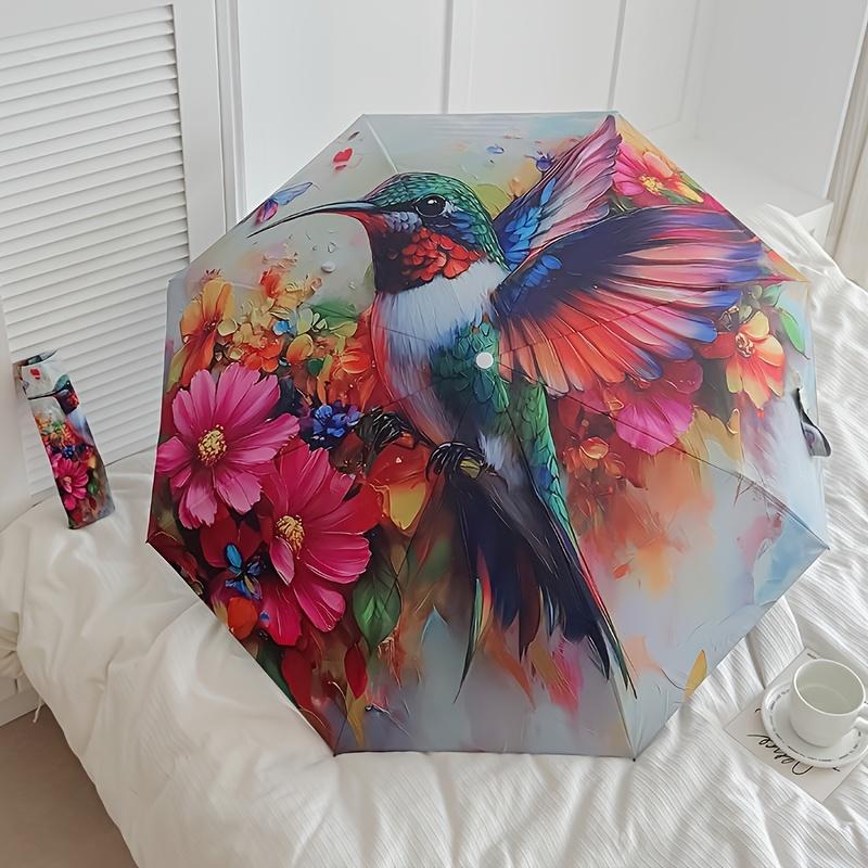 A Vibrant Hummingbird And Floral Print Umbrella, Featuring Automatic Folding, And Shielding. This Sturdy And Durable Umbrella with Eight Rib
A Vibrant Hummingbird And Floral Print Umbrella, Featuring Automatic Folding, And Shielding. This Sturdy And Durable Umbrella with Eight Rib