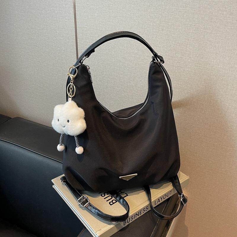Lightweight and versatile large-capacity nylon cloth tote bag 2025 autumn new double shoulder back bag single shoulder messenger bag
Lightweight and versatile large-capacity nylon cloth tote bag 2025 autumn new double shoulder back bag single shoulder messenger bag