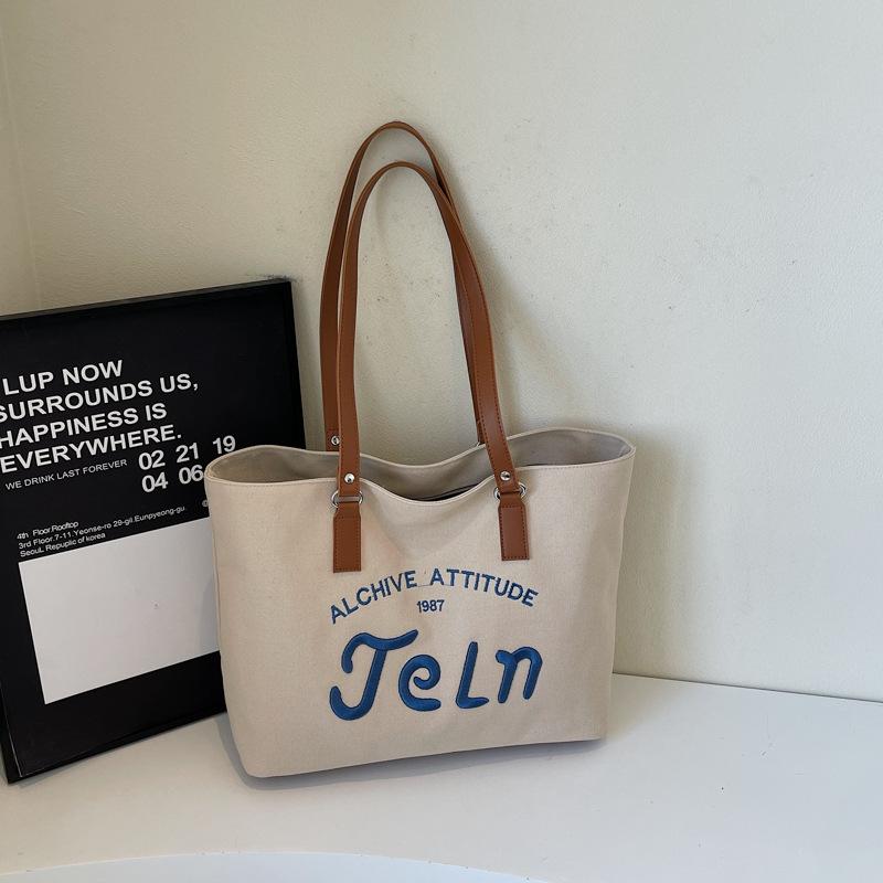 Весна 2025 новая большая вместимость студенты ездят на занятия на плечевая сумка-тоут повседневная мода высокая ценность сумочка хаки