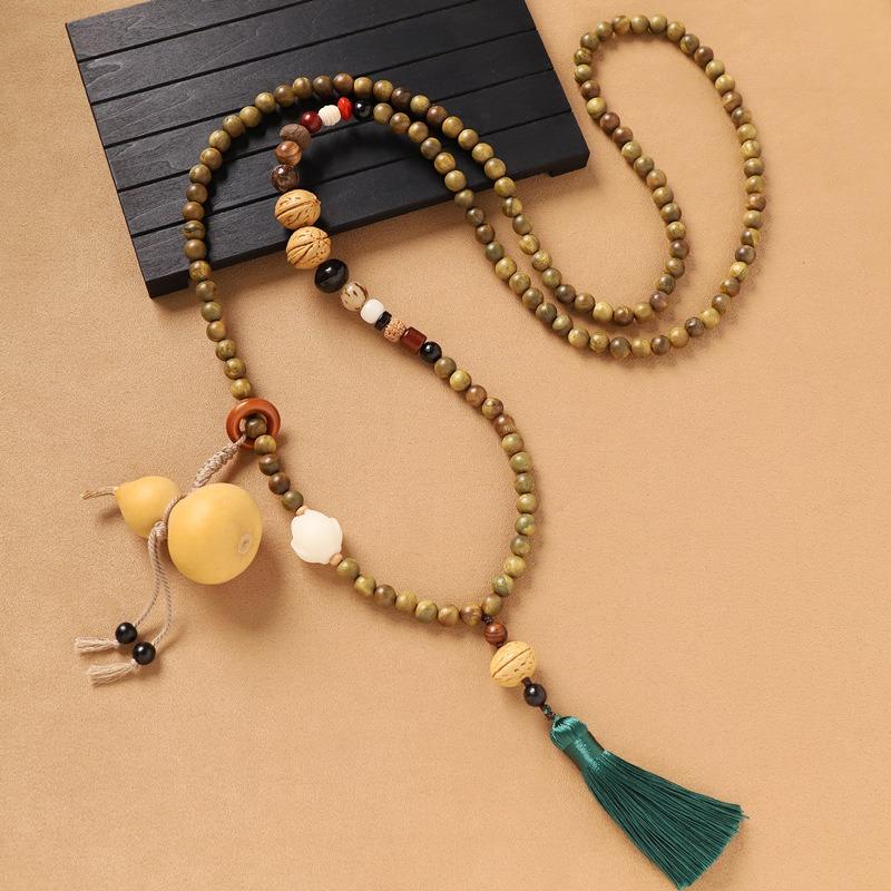 Green sandalwood crossbody chain gourd Duobao beaded necklace niche literary long cheongsam back chain female
Green sandalwood crossbody chain gourd Duobao beaded necklace niche literary long cheongsam back chain female