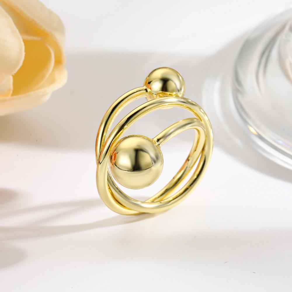 Покрытое медью золото, оплетенное проволокой, полый шар, тройное открытое кольцо
Покрытое медью золото, оплетенное проволокой, полый шар, тройное открытое кольцо