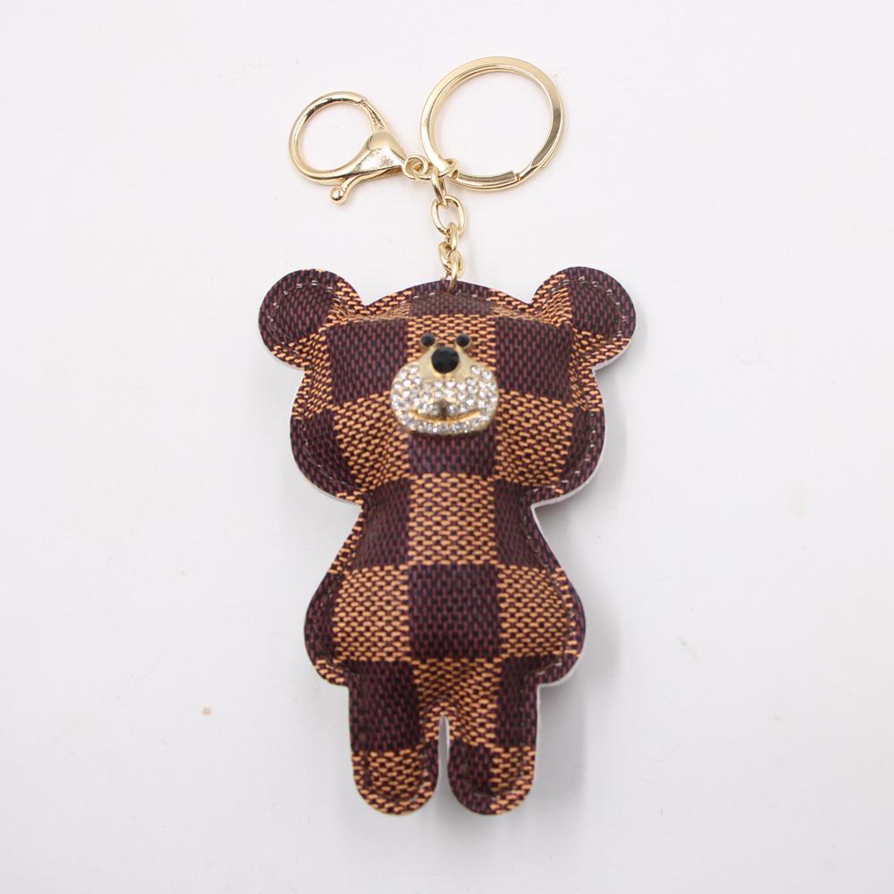 Шкіряний брелок із милим мультяшним ведмедиком у стилі ретро для шкільних ранців, автомобілів і телефонів Gold Key Ring
Шкіряний брелок із милим мультяшним ведмедиком у стилі ретро для шкільних ранців, автомобілів і телефонів Gold Key Ring