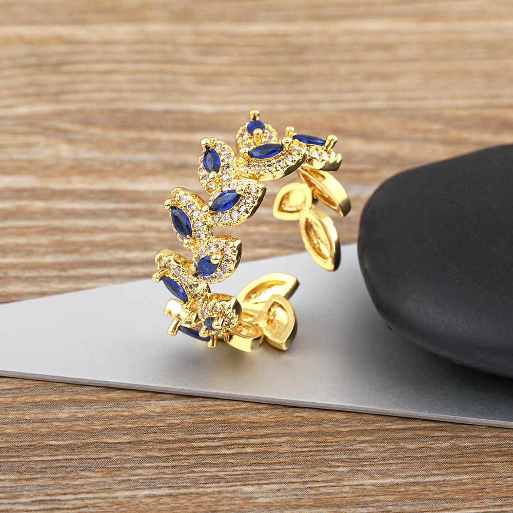 European and American wide face tree leaf shaped inlaid with colored zircon geometric opening personalized ring for women opening adjustable синий
European and American wide face tree leaf shaped inlaid with colored zircon geometric opening personalized ring for women opening adjustable синий