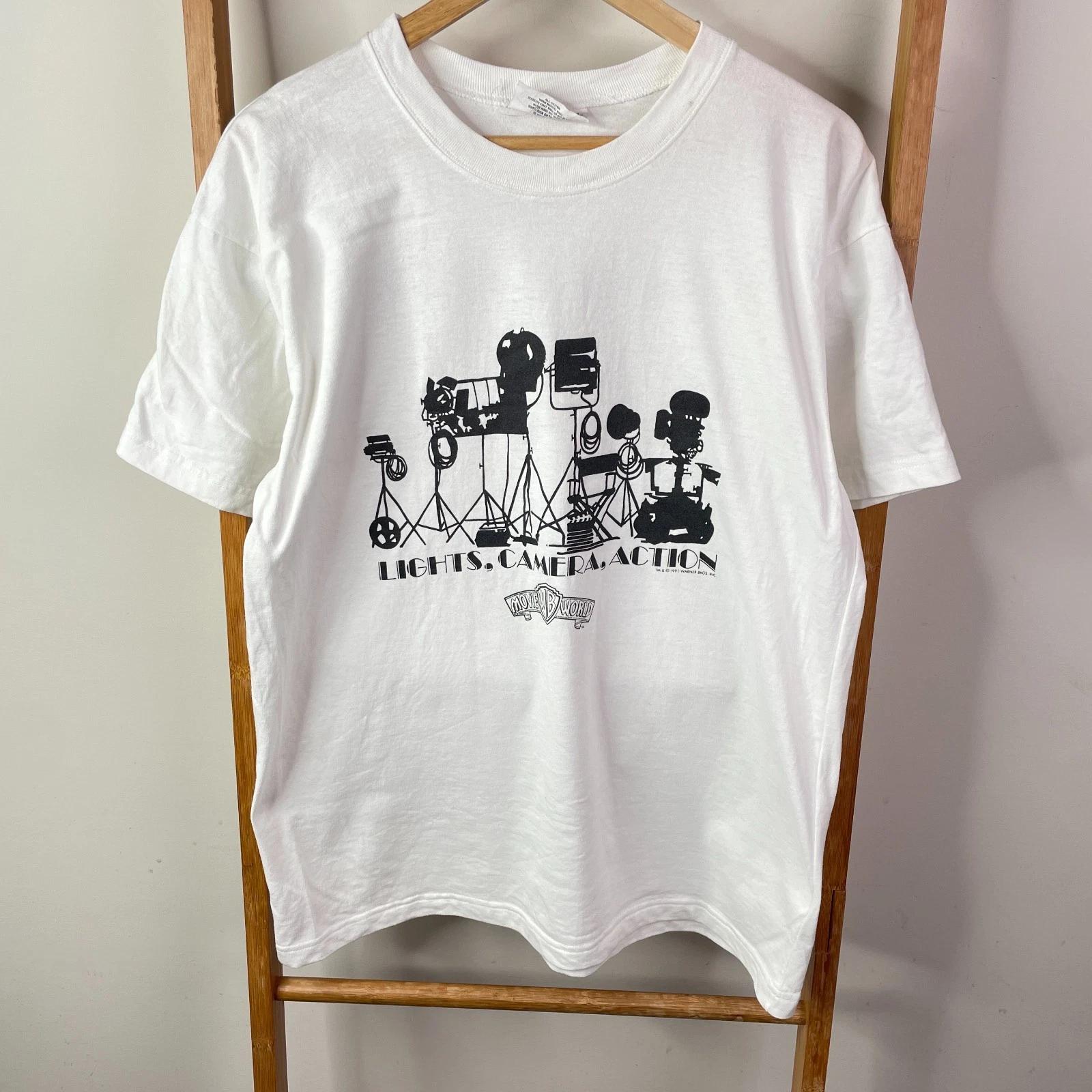 Warner Bros. Shirt Mens Large White Lights Camera Action Movie World 1991 Casual L
Warner Bros. Shirt Mens Large White Lights Camera Action Movie World 1991 Casual L