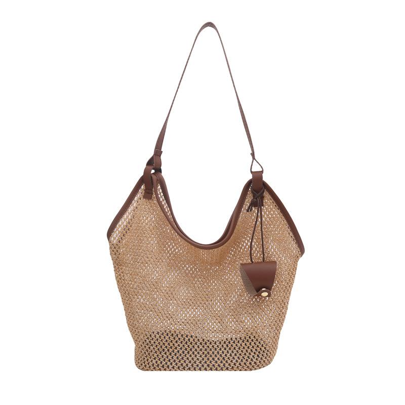Summer new woven straw bag women s fashion niche shoulder bucket bag seaside beach bag коричневий
Summer new woven straw bag women s fashion niche shoulder bucket bag seaside beach bag коричневий