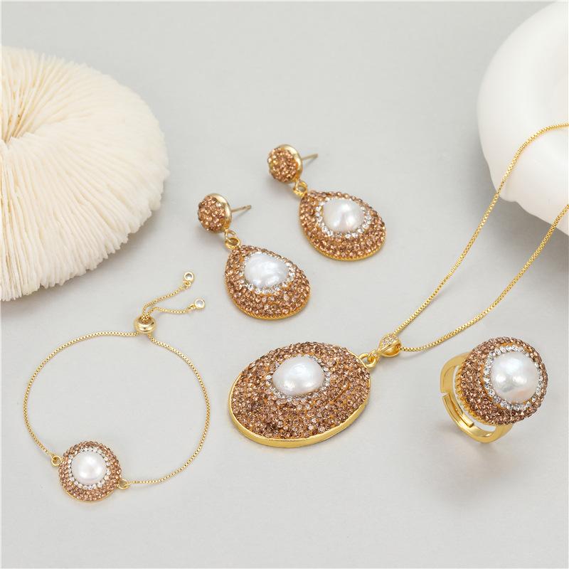 Meier Pre-owned jewelry set - four piece: necklace, bracelet, earrings, and ring with natural baroque pearls
Meier Pre-owned jewelry set - four piece: necklace, bracelet, earrings, and ring with natural baroque pearls