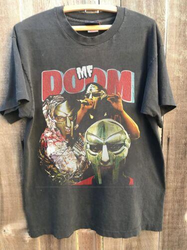 MF Doom Black Short Sleeve Cotton T-shirt Unisex S-5XL Reprint Graphic Short Sleeve Shirt Unisex Men Women Summer 4XL
MF Doom Black Short Sleeve Cotton T-shirt Unisex S-5XL Reprint Graphic Short Sleeve Shirt Unisex Men Women Summer 4XL