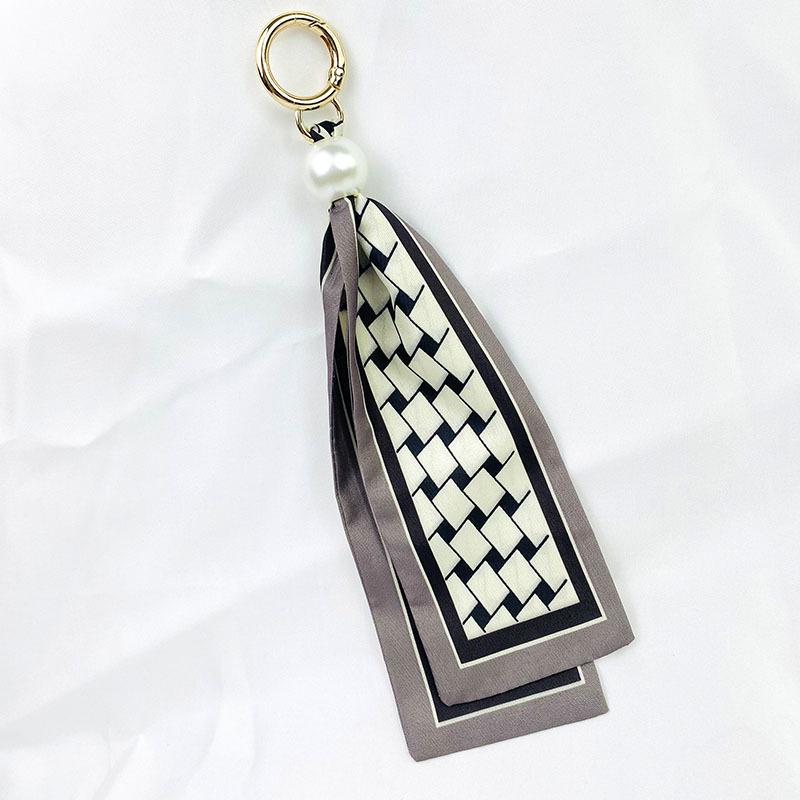 Retro Bow Tassel Scarf Keychain - Korean Fashion Charm Pendant
Retro Bow Tassel Scarf Keychain - Korean Fashion Charm Pendant