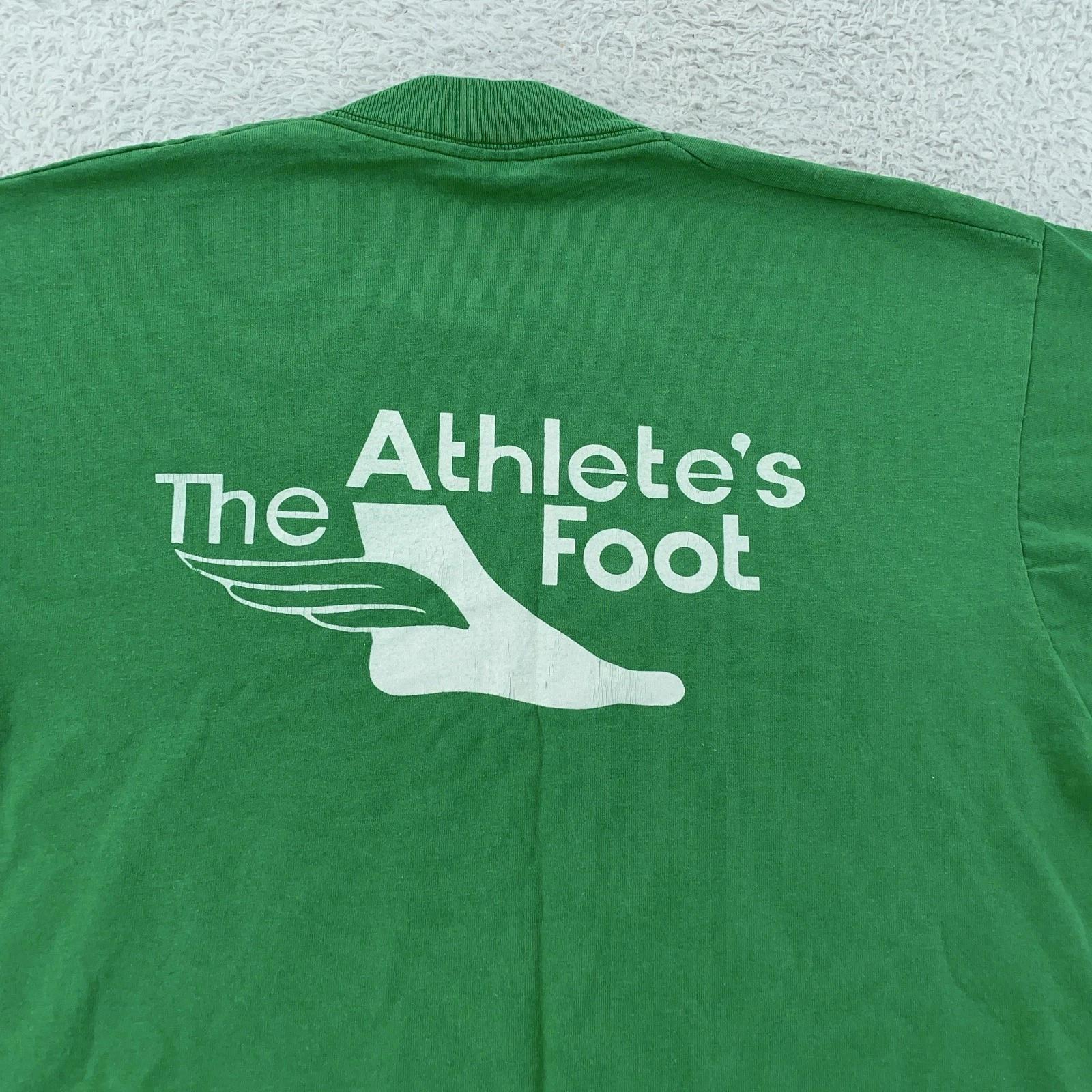 Vtg 90s The Athlete s Foot Shirt Mens FITS M Green Graphic Promo Crew Neck USA XL
Vtg 90s The Athlete s Foot Shirt Mens FITS M Green Graphic Promo Crew Neck USA XL