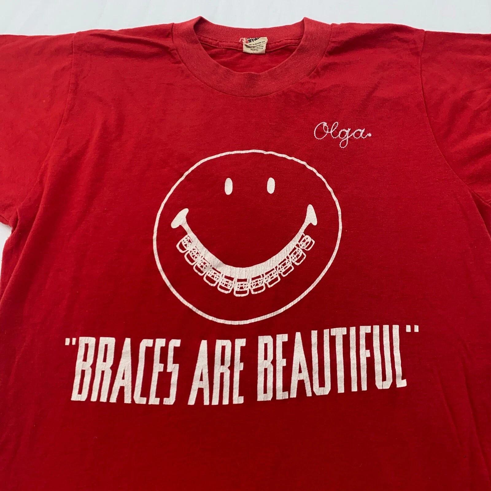 vintage 80s BRACES ARE BEAUTIFUL OLGA EMBROIDERED T-Shirt 2XS/XS orthodontist M
vintage 80s BRACES ARE BEAUTIFUL OLGA EMBROIDERED T-Shirt 2XS/XS orthodontist M
