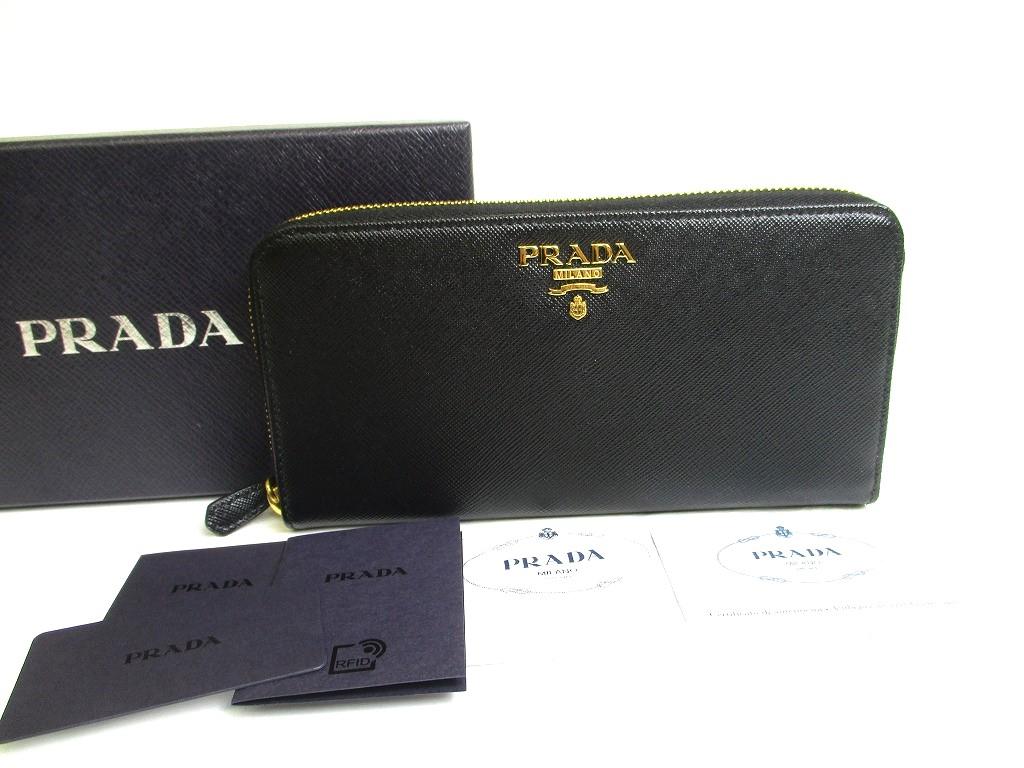 Справжній довгий гаманець PRADA Saffiano Black Leather H/W Large Round Zip #a616 Refurbished
Справжній довгий гаманець PRADA Saffiano Black Leather H/W Large Round Zip #a616 Refurbished