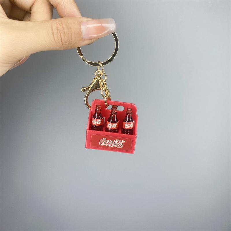 Miniature Bottle Carrier Keychain with Three Small Bottles and Metal Key Ring and Clip Suitable for Keys and Bag Accessories One Size
Miniature Bottle Carrier Keychain with Three Small Bottles and Metal Key Ring and Clip Suitable for Keys and Bag Accessories One Size