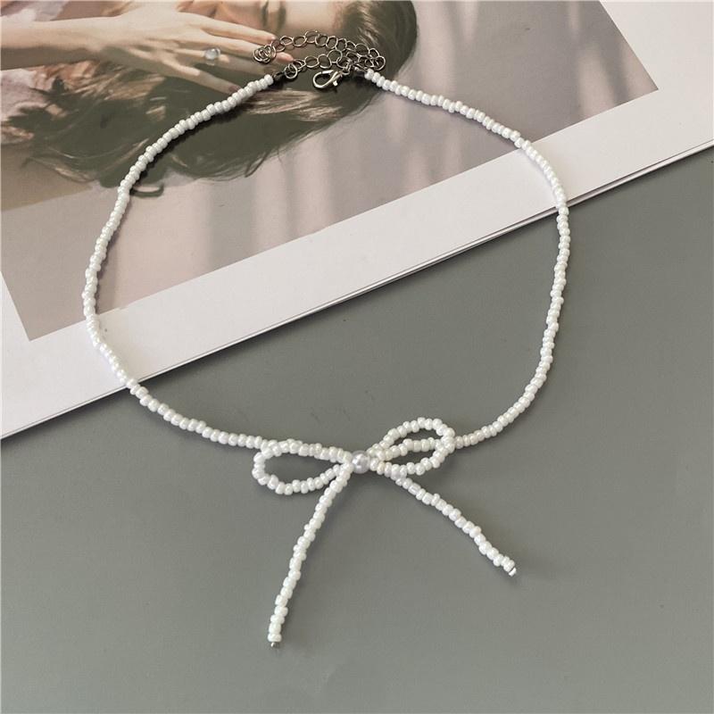 Korean Fashion Knotbow Choker Necklace for Girl Trendy Romantic Handmade Rice Beads Short Neck Zircon Gift for Friend Wholesale
Korean Fashion Knotbow Choker Necklace for Girl Trendy Romantic Handmade Rice Beads Short Neck Zircon Gift for Friend Wholesale