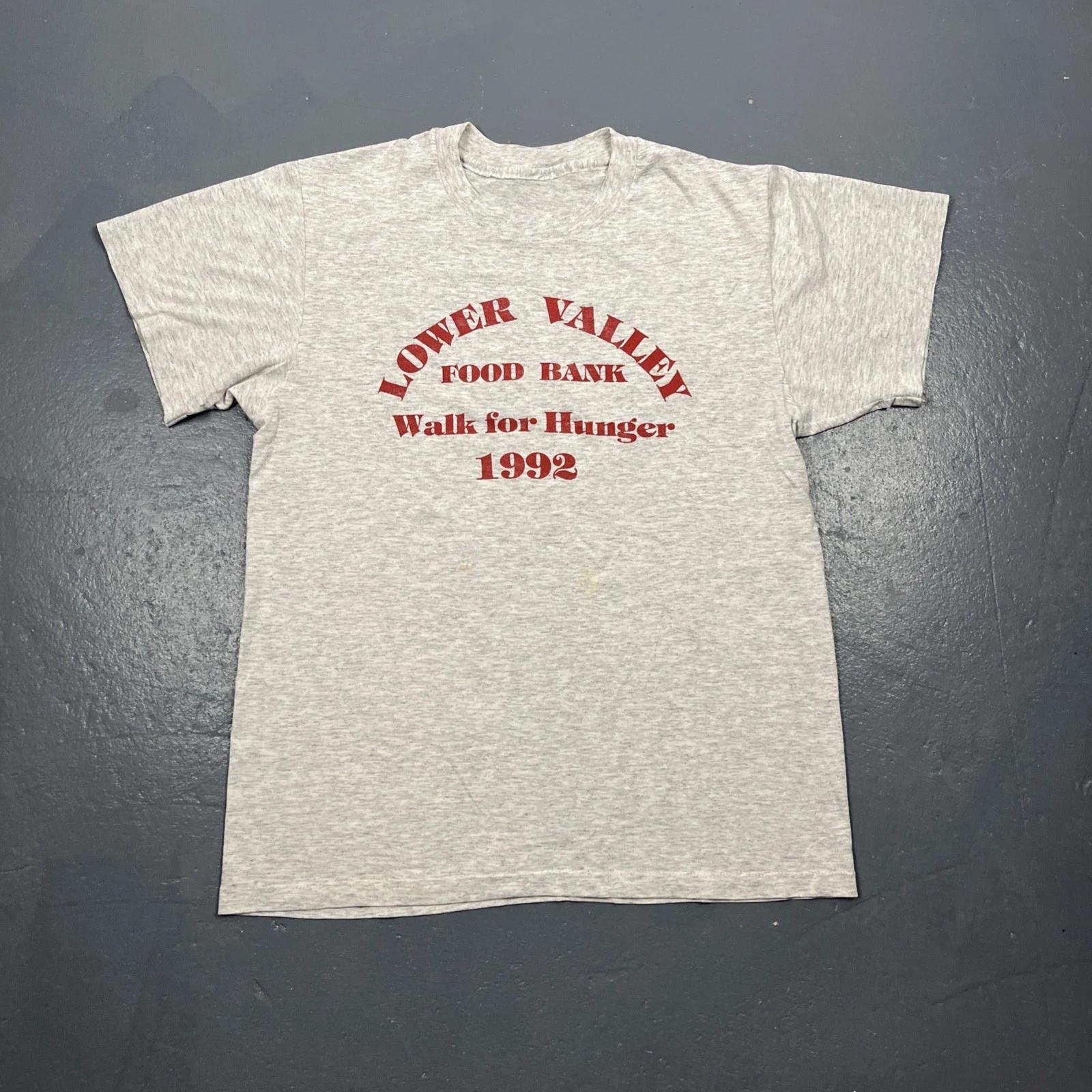 Vintage 1992 Lower Valley Food Bank Walk For Hunger Tshirt Grey Medium VTG 90s 4XL
Vintage 1992 Lower Valley Food Bank Walk For Hunger Tshirt Grey Medium VTG 90s 4XL