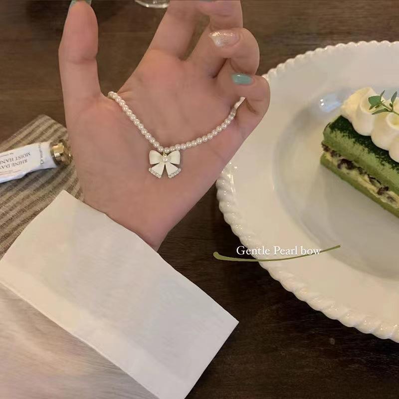 Pearl bow necklace women s summer senior design sense niche beaded collarbone chain choker neck chain accessories
Pearl bow necklace women s summer senior design sense niche beaded collarbone chain choker neck chain accessories