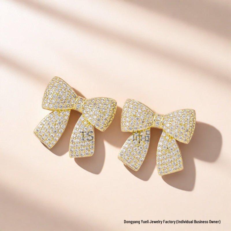 Gold-Plated Brass Earrings with 5A Zircon and Micro-Paved Bow Design
Gold-Plated Brass Earrings with 5A Zircon and Micro-Paved Bow Design