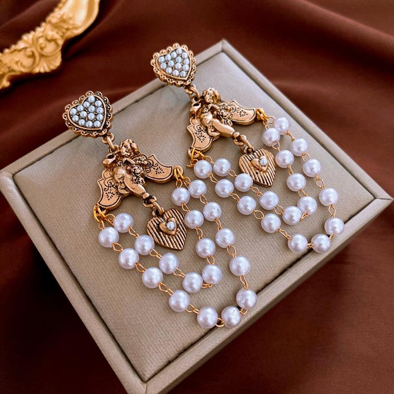 Французские ретро серьги с жемчужной бахромой, преувеличенные нишевые серьги высокого класса, модные универсальные серьги с темпераментом
Французские ретро серьги с жемчужной бахромой, преувеличенные нишевые серьги высокого класса, модные универсальные серьги с темпераментом