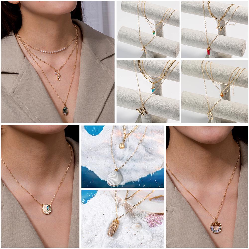 Summer Ocean Style Necklace: Multi-layer Shell & Natural Stone Pendant with 26 Letters for Women
Summer Ocean Style Necklace: Multi-layer Shell & Natural Stone Pendant with 26 Letters for Women