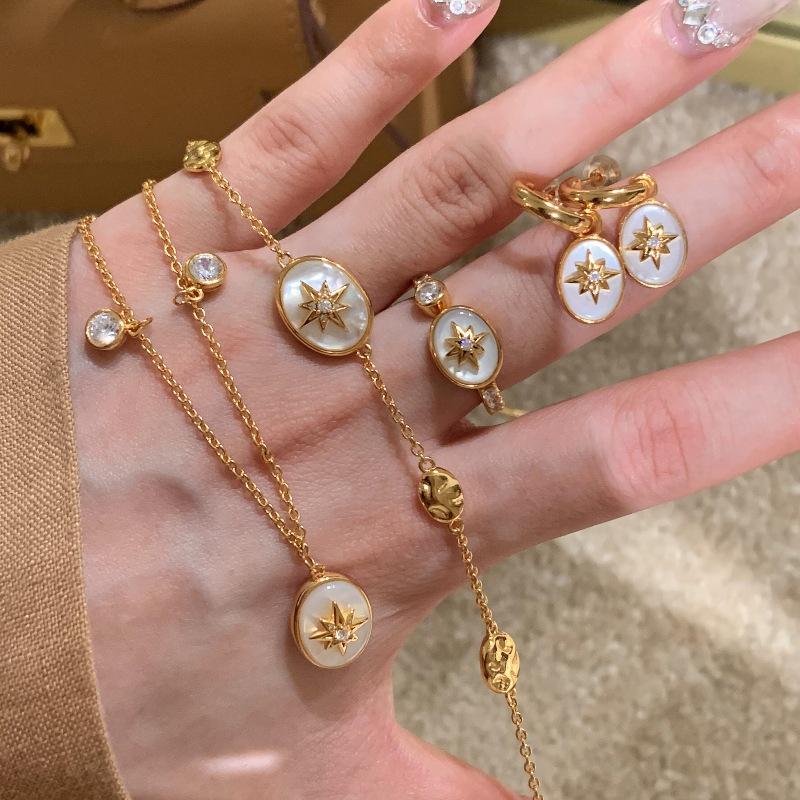 French Luxury Mother-of-Pearl Star Jewelry Set: Necklace, Bracelet, Ring, Earrings with Tassel and Diamond Accent
French Luxury Mother-of-Pearl Star Jewelry Set: Necklace, Bracelet, Ring, Earrings with Tassel and Diamond Accent