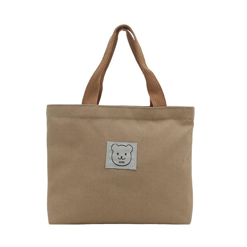 Студенческая холщовая сумка-тоут 2025 новый девчачий стиль милый медвежонок сумка для ланч-бокса простая ручная сумка хаки
Студенческая холщовая сумка-тоут 2025 новый девчачий стиль милый медвежонок сумка для ланч-бокса простая ручная сумка хаки