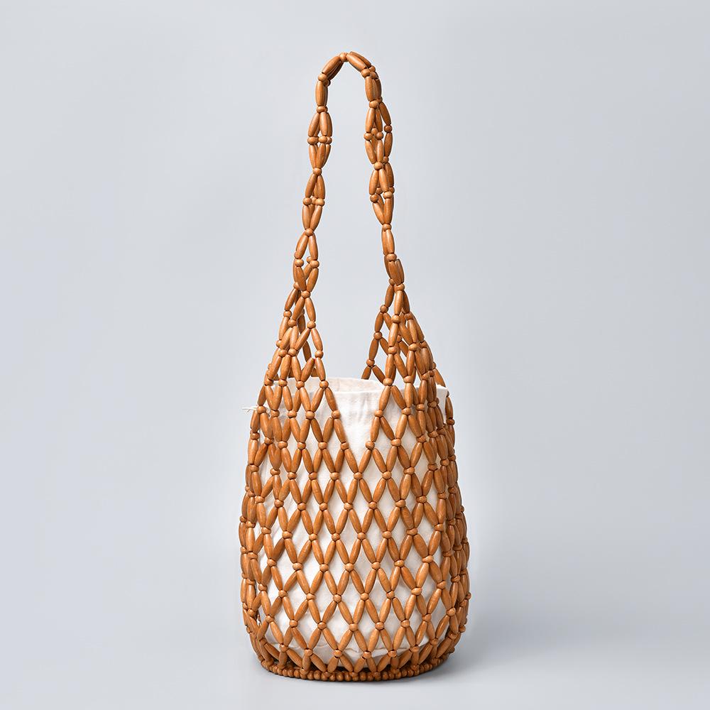 Women s Summer Woven Bag: Niche Design with Hollow Wooden Beads, Portable Bucket, and Shoulder Strap. 17x17x36 cm
Women s Summer Woven Bag: Niche Design with Hollow Wooden Beads, Portable Bucket, and Shoulder Strap. 17x17x36 cm