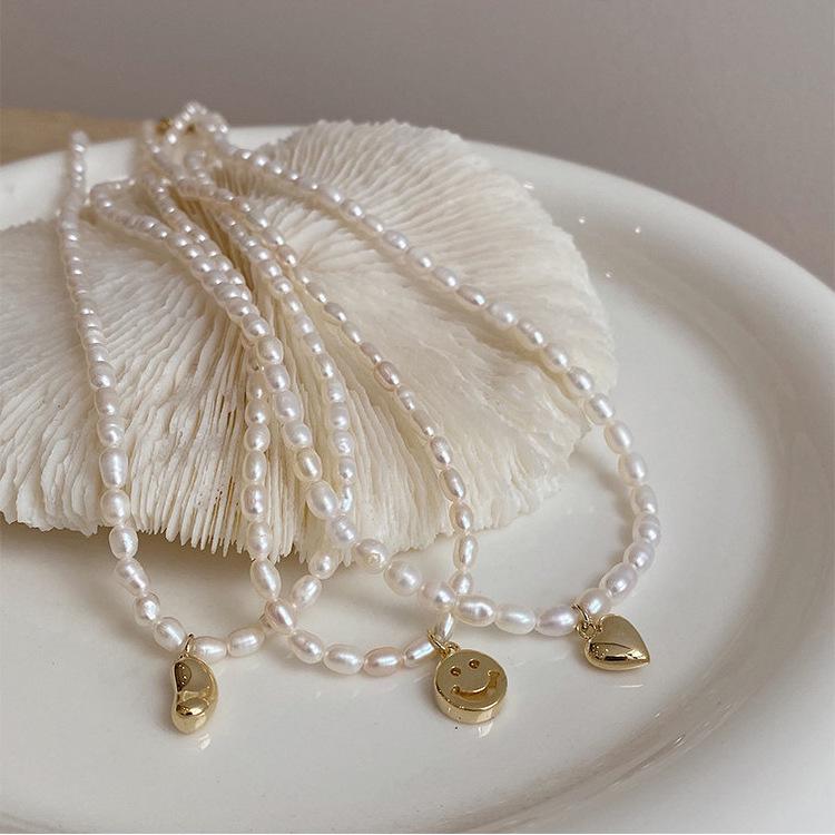 Women s Fairy Pearl Heart Pendant Necklace - Cool Choker Style with Smiley Face and Acacia Bean Clavicle Chain
Women s Fairy Pearl Heart Pendant Necklace - Cool Choker Style with Smiley Face and Acacia Bean Clavicle Chain