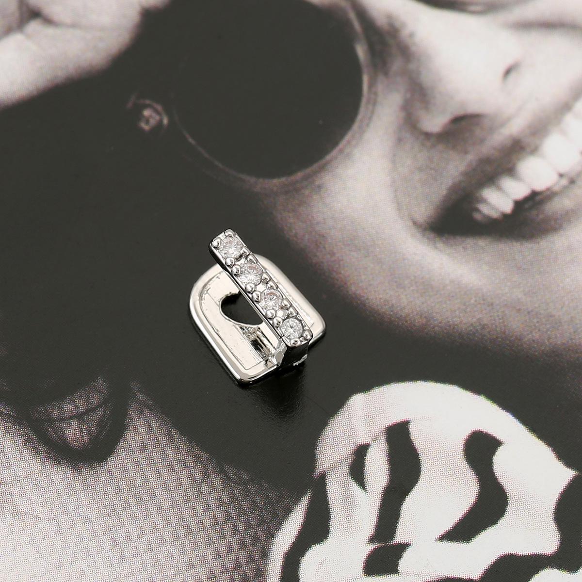 Gold Tooth Grillz with Diamond Inlay - Hip Hop Style Dental Ornament
Gold Tooth Grillz with Diamond Inlay - Hip Hop Style Dental Ornament