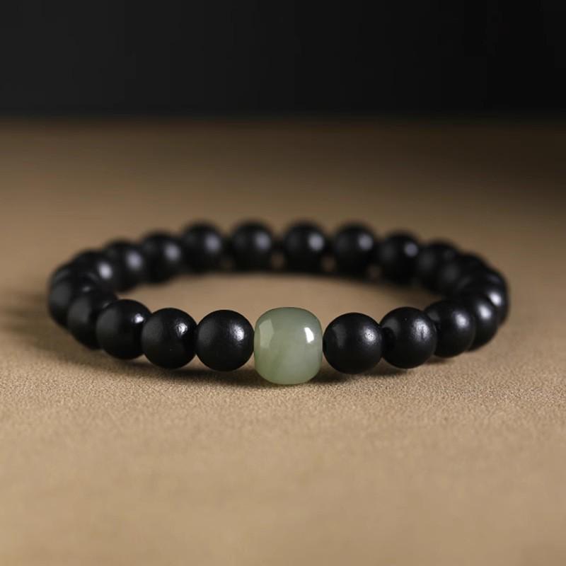 Унисекс браслет из черного дерева и золотистого сандала с буддийскими бусинами
Унисекс браслет из черного дерева и золотистого сандала с буддийскими бусинами