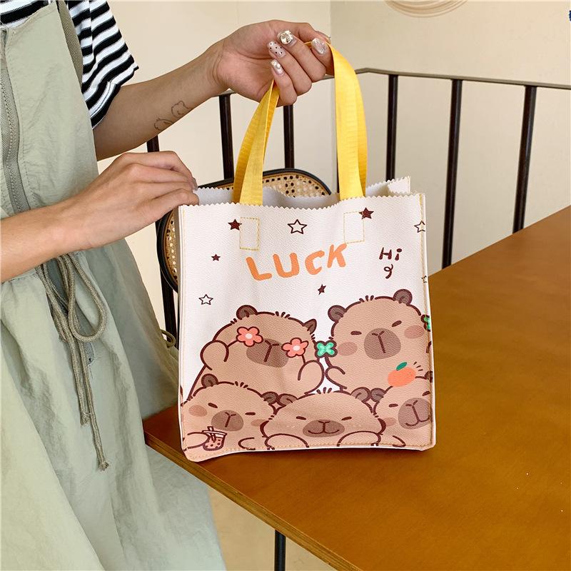Trendy handbag bag souvenir cartoon capybara student large-capacity handbag storage bag
Trendy handbag bag souvenir cartoon capybara student large-capacity handbag storage bag