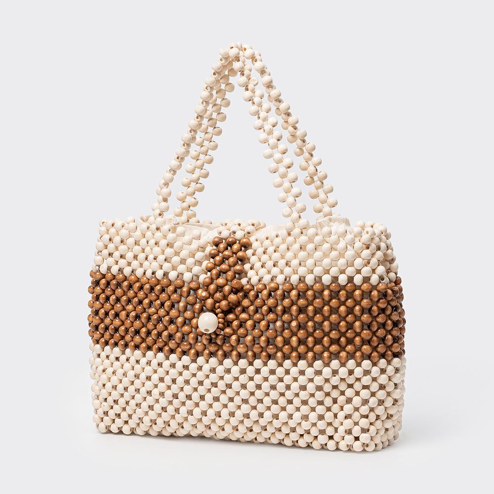 Handmade Wooden Bead Bag New Women s Contrasting Color Tote Bag Bohemian Beaded Hollow-out Reticulate Netted Beach Handbags
Handmade Wooden Bead Bag New Women s Contrasting Color Tote Bag Bohemian Beaded Hollow-out Reticulate Netted Beach Handbags