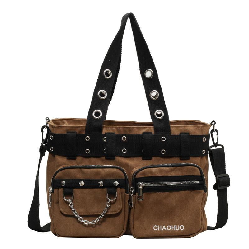 Canvas Bag Women s New Rivet Punk Style Hand-held Commuting Bag Large Capacity Fashionable Casual Shoulder Support світло-коричневого кольору
Canvas Bag Women s New Rivet Punk Style Hand-held Commuting Bag Large Capacity Fashionable Casual Shoulder Support світло-коричневого кольору