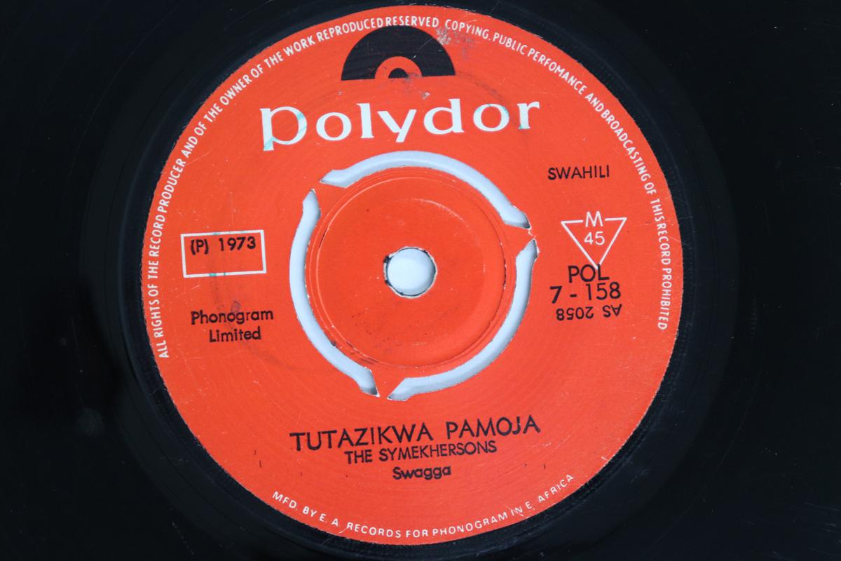 7-дюймовая пластинка SYMEKHERSONS - Нас похоронят вместе / Rev. Джозеф К. S POL7158 POLYDOR 1973 Кения Мировая музыка Б/У
7-дюймовая пластинка SYMEKHERSONS - Нас похоронят вместе / Rev. Джозеф К. S POL7158 POLYDOR 1973 Кения Мировая музыка Б/У