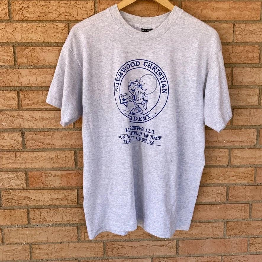 Sherwood Christian Academy Hebrews 12:1 running graphic single stitch t-shirt XL 2XL
Sherwood Christian Academy Hebrews 12:1 running graphic single stitch t-shirt XL 2XL