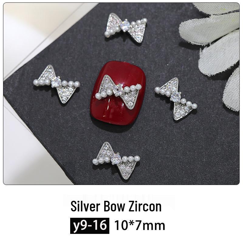 Серебряный бант циркон нейл-арт: Роскошные украшения «Звезды и бабочки» с бриллиантовыми акцентами
Серебряный бант циркон нейл-арт: Роскошные украшения «Звезды и бабочки» с бриллиантовыми акцентами