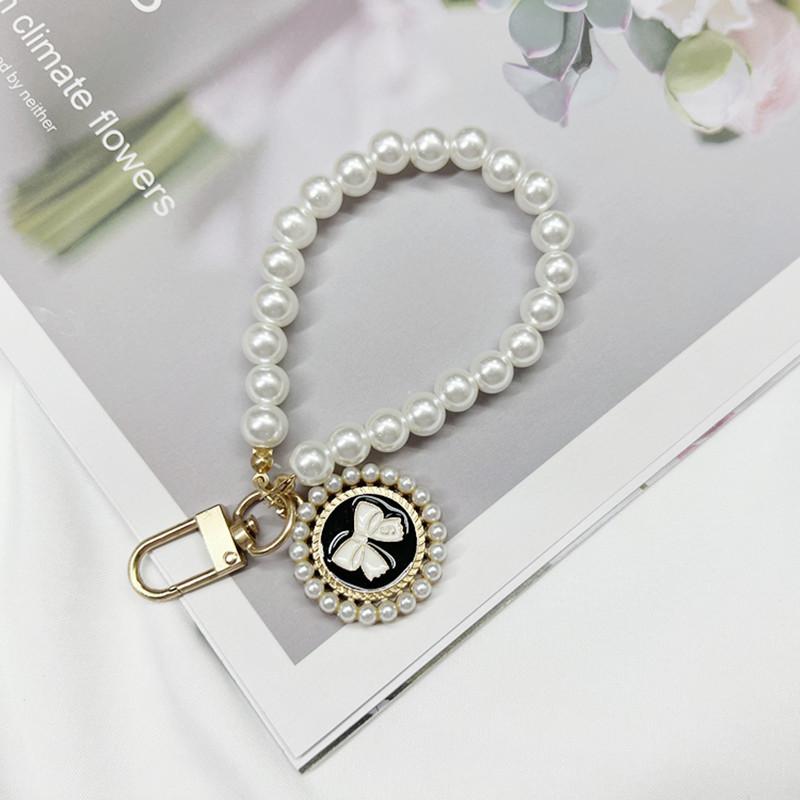 Short Plastic Pearl Bead Phone Chain Bow Circular Pendant Phone Hanging Chain Wrist Chain Phone Case Accessory Simple and Cute
Short Plastic Pearl Bead Phone Chain Bow Circular Pendant Phone Hanging Chain Wrist Chain Phone Case Accessory Simple and Cute
